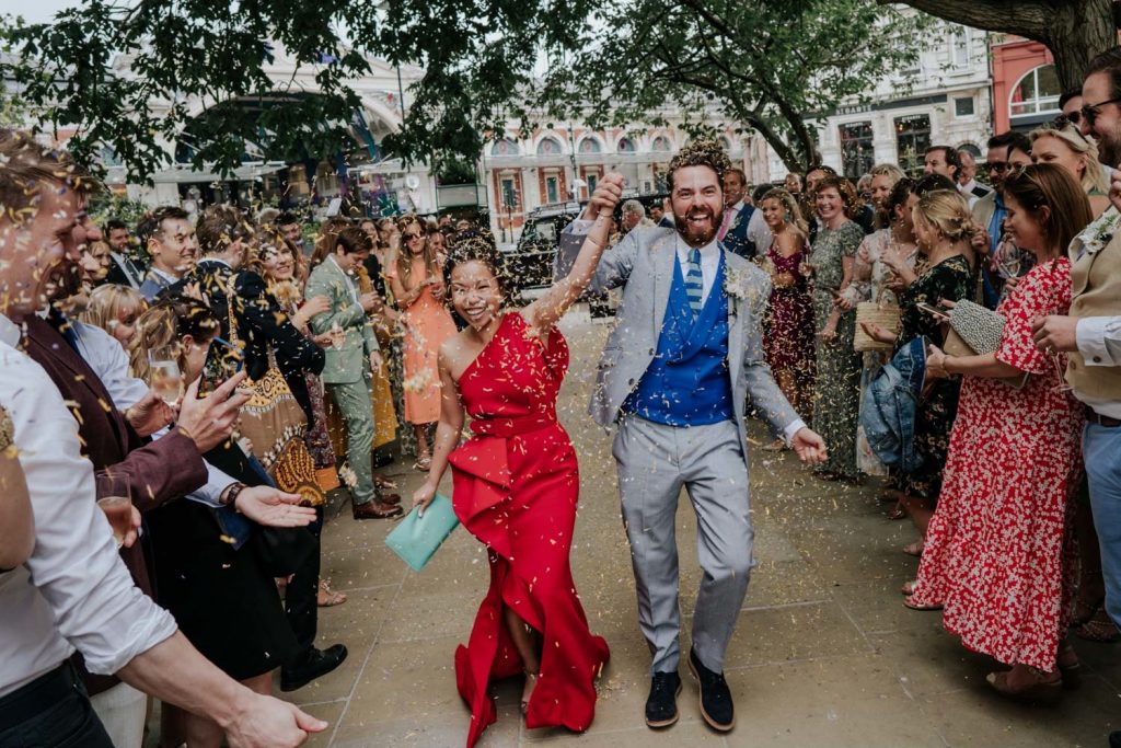 balfour st barts wedding with confetti exit and bride in a red dress, groom in blue suit