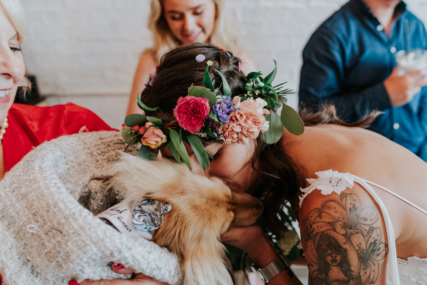 bride kissing her dog ring bearer