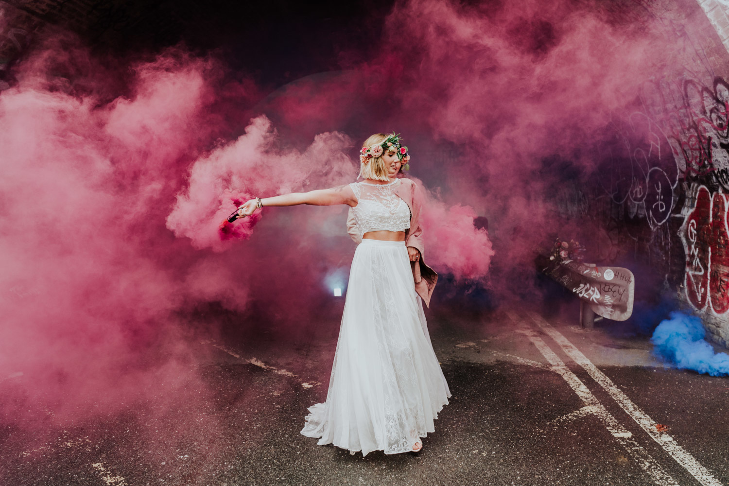 lesbian brides with pink smoke bombs