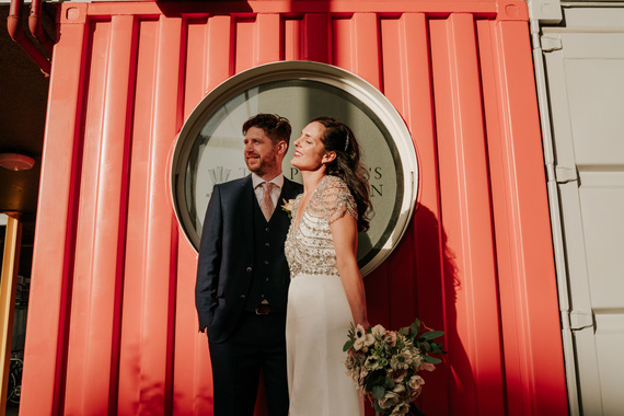 Trinity Buoy Wharf wedding couple looking into afternoon sunlight
