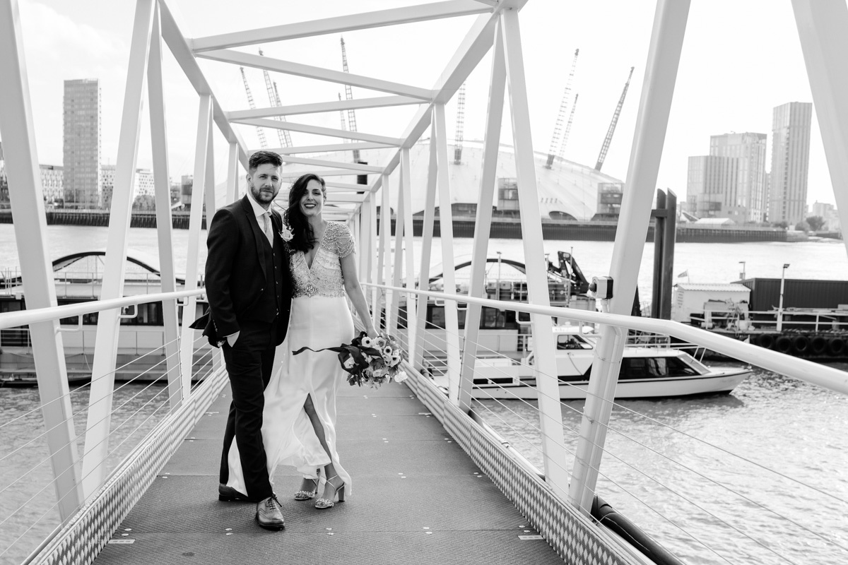 bride and groom on trinity buoy wharf pier