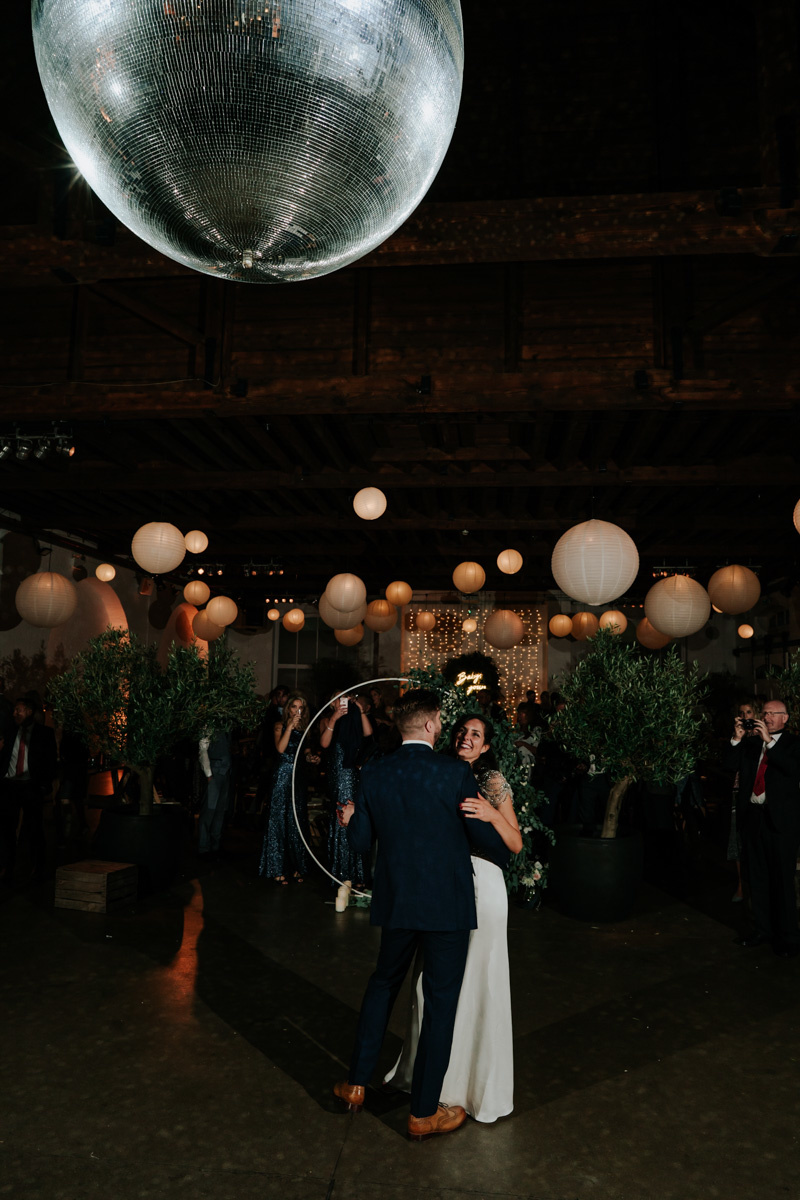 first dance at chainstore with disco ball and paper lanterns