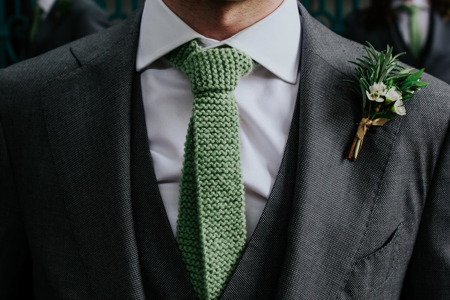 sage green knitted tie and green suit