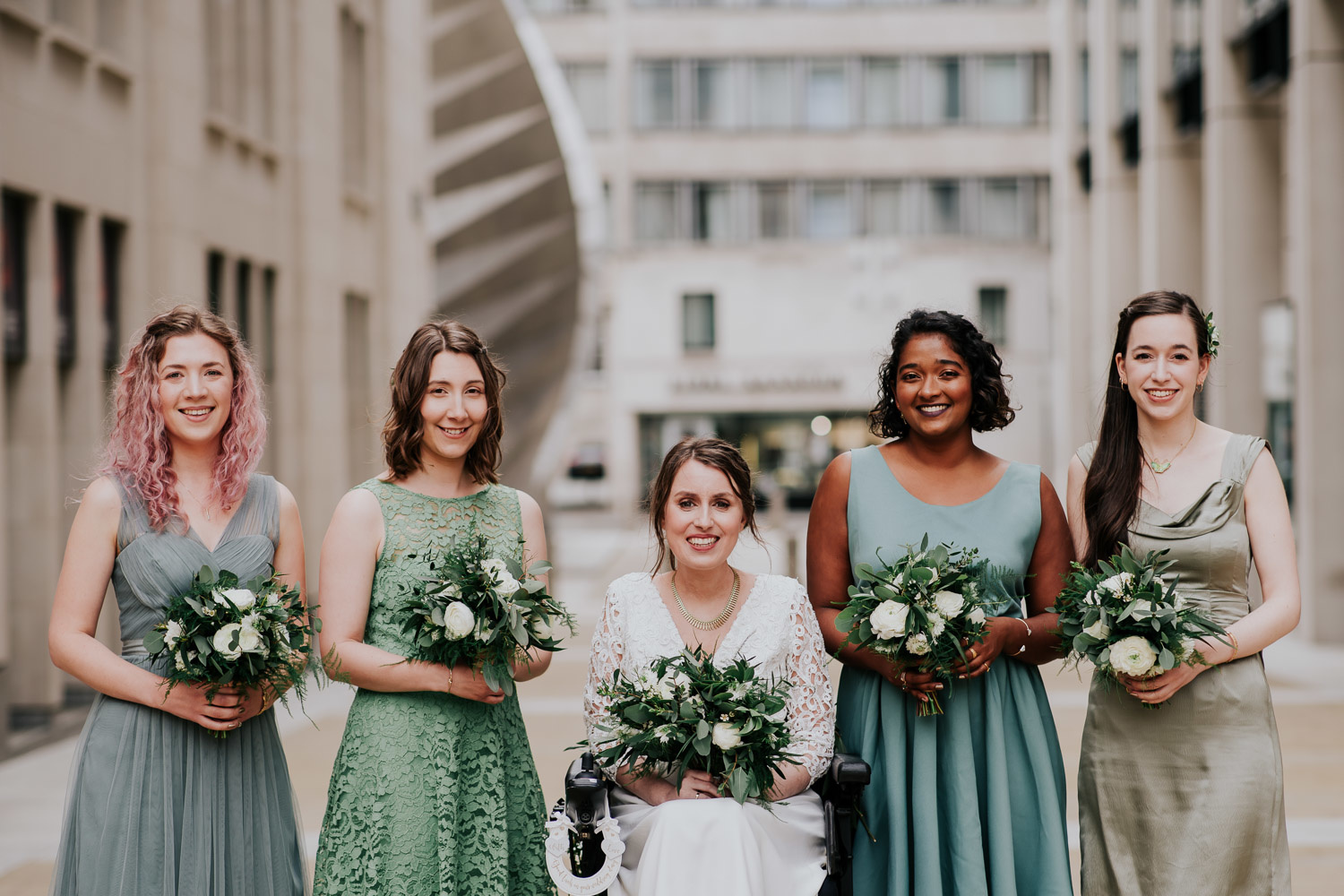 bride and bridesmaids in green dresses