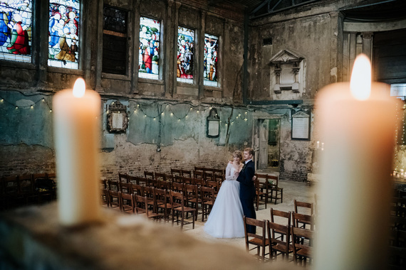 Creative wedding photography at quirky Asylum Chapel in Peckham with bride and groom looking away