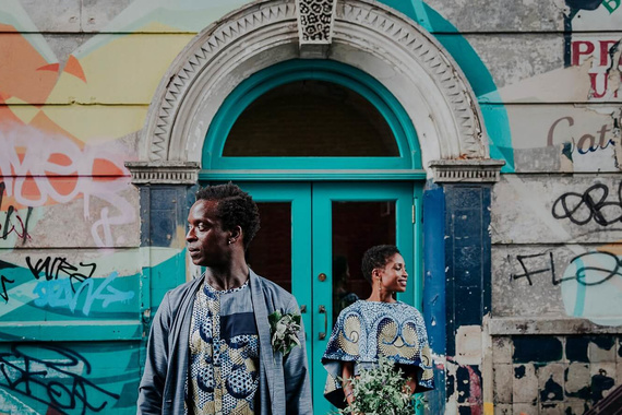 Colourful alternative wedding photography in Brixton. Cultural wedding with couple in blue african outfits. Creative and cool wedding photos