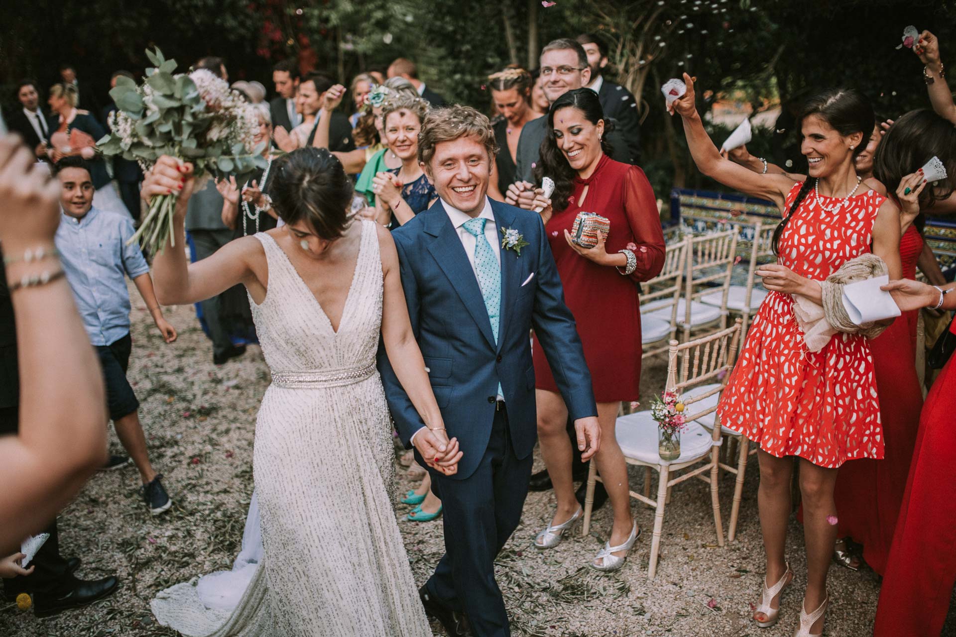 confetti exit bride and groom smiling