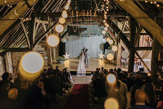 fairy lights intimate wedding ceremony at the great barn in titchfield, hampshire by creative wedding photographer