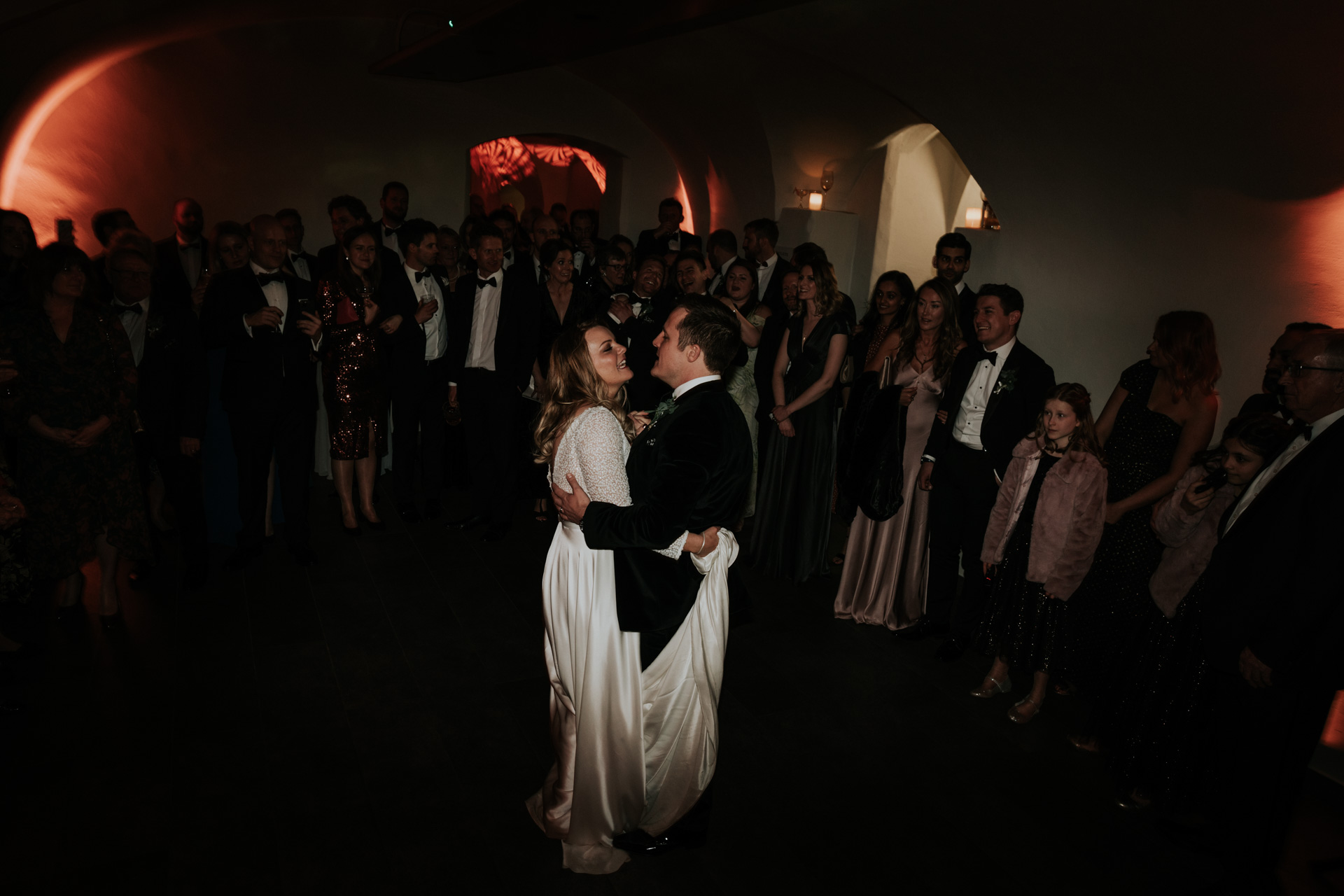 bride and groom dancing in the vaults of queens house