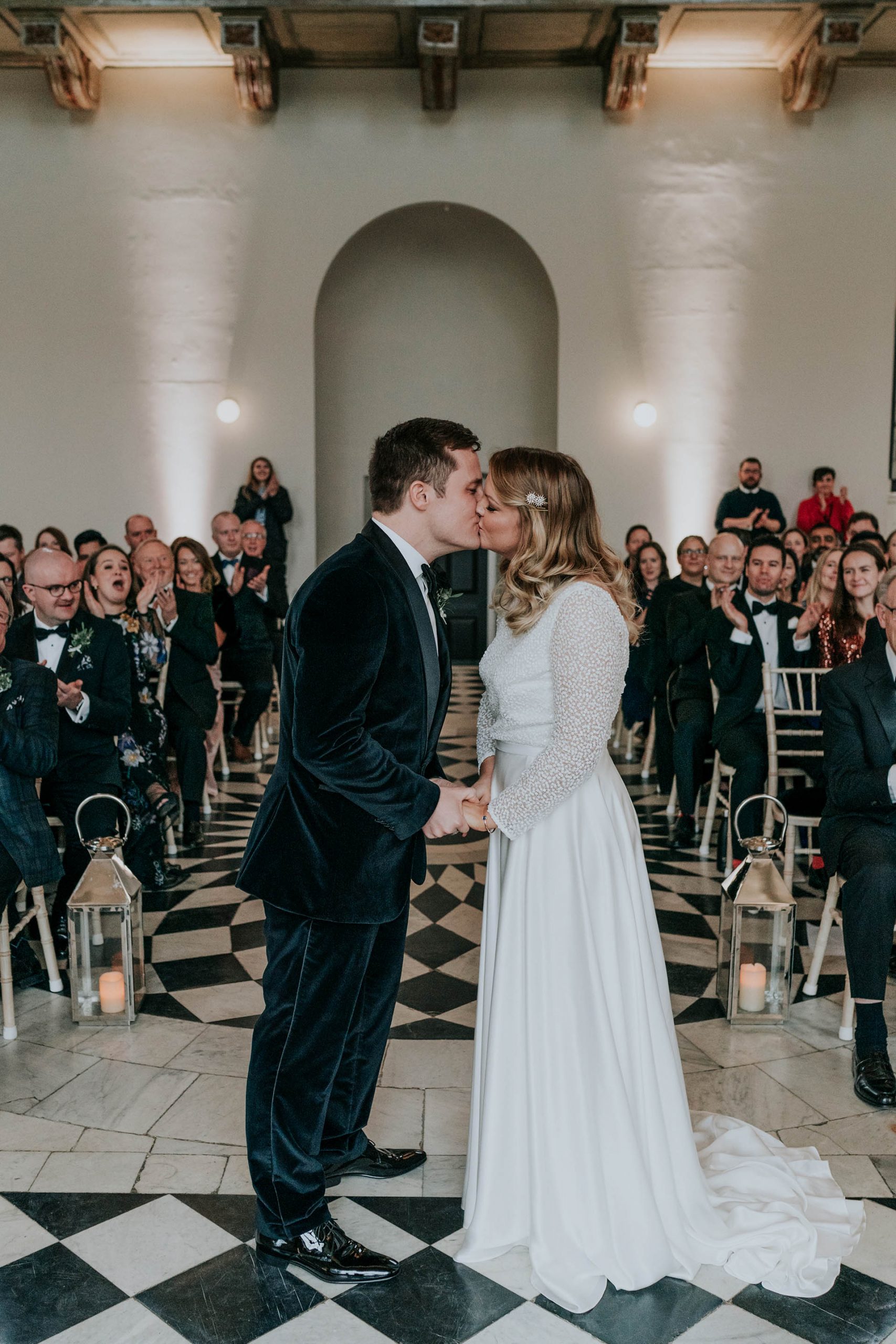 first kiss after wedding ceremony in the great hall of Queens House