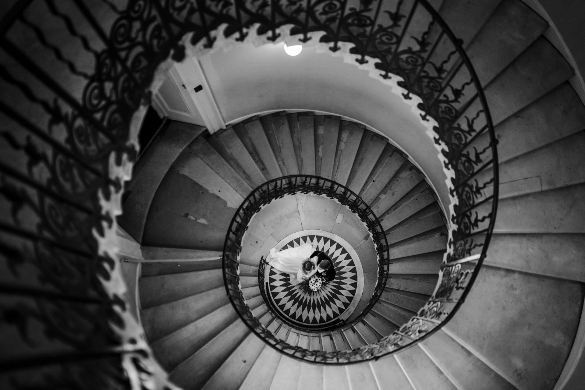 spiral staircase with bride and groom