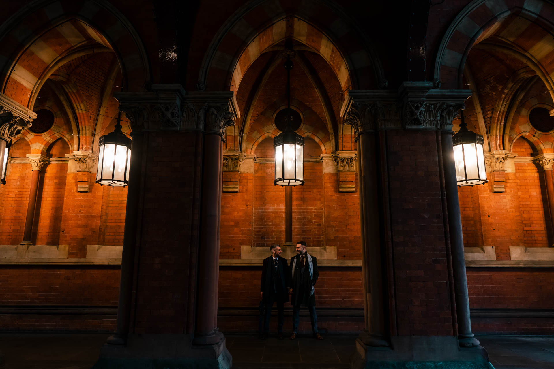 two grooms under a lamp in st pancras
