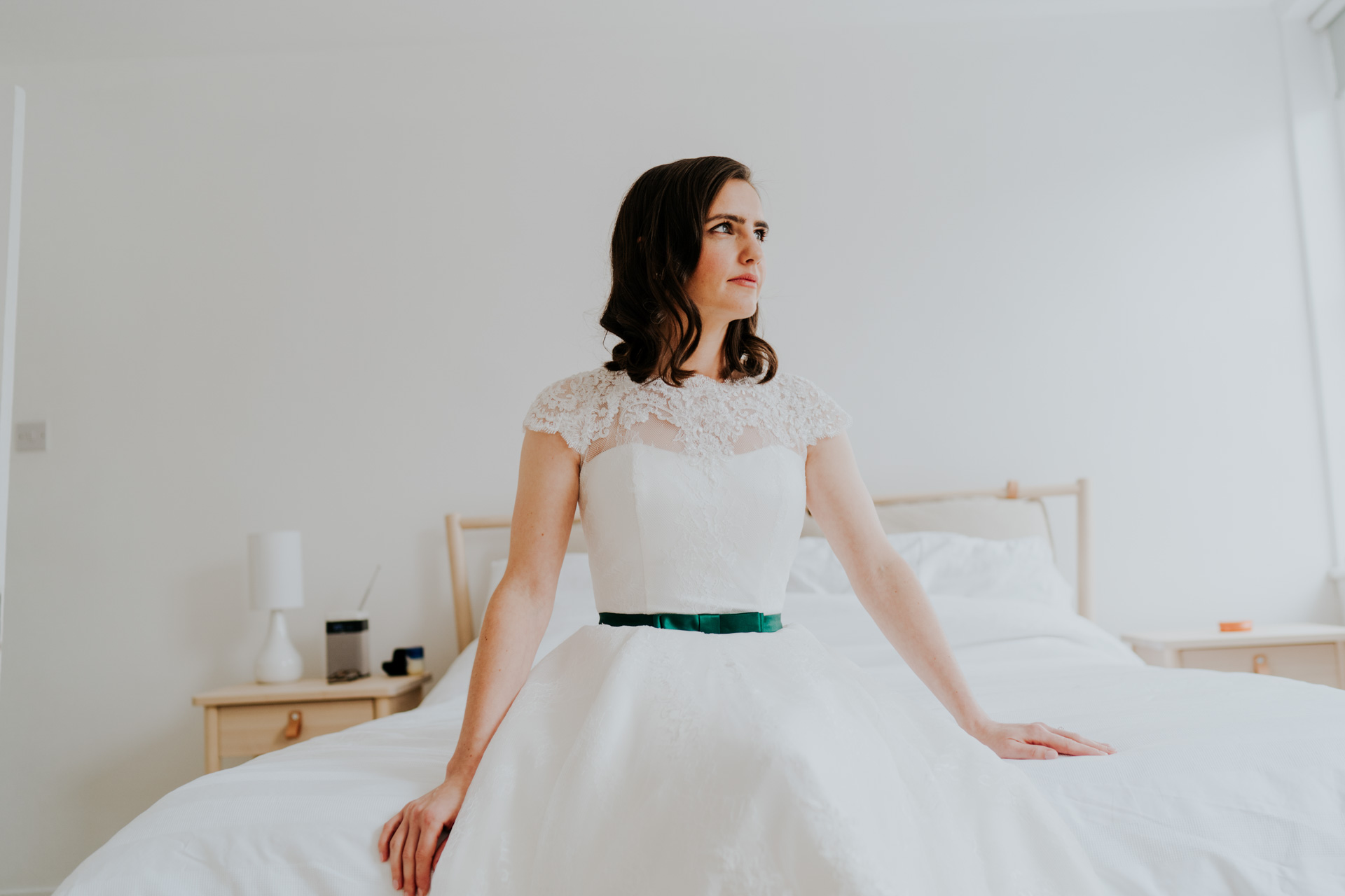 bride sitting on a bed