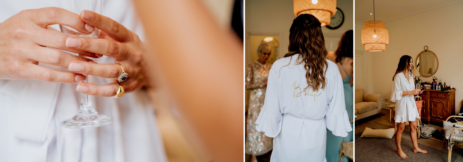 bride in a white bathrobe holding a prosecco glass