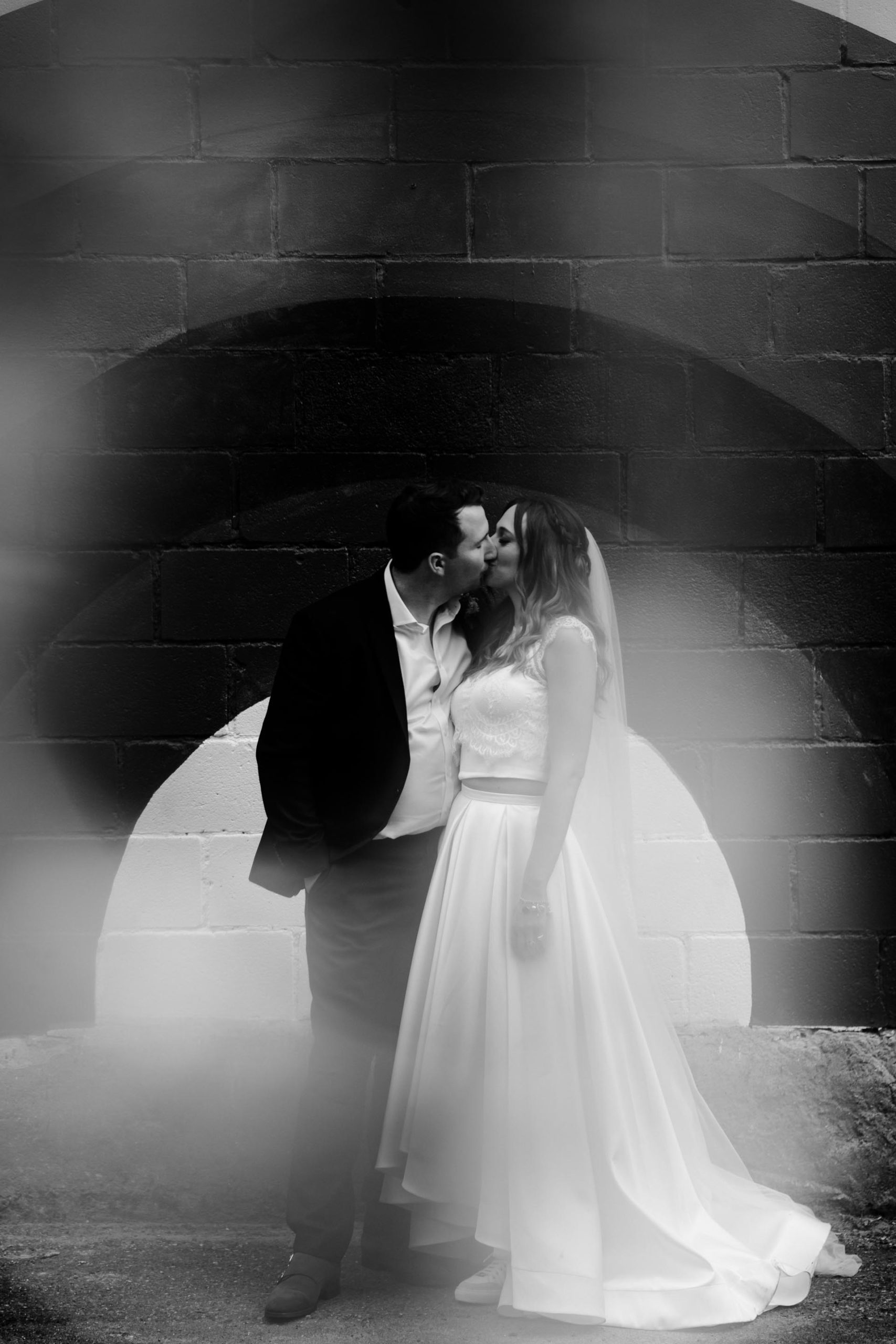100 barrington bride and groom kissing photo in black and white