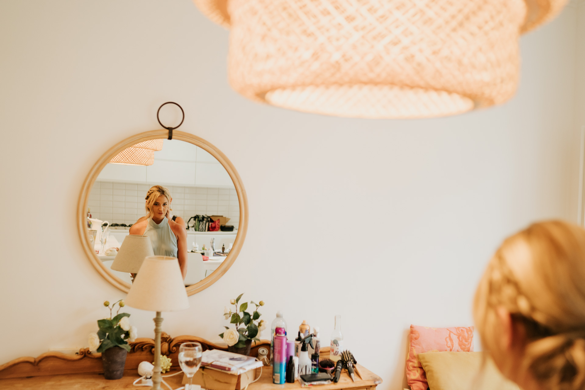 mirro reflection of a bridesmaid