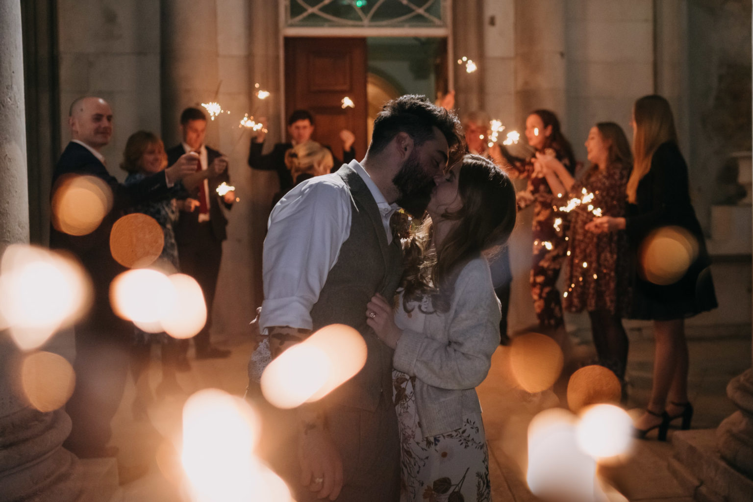 bride and groom kissing during sparkler exit at beckenham place mansion