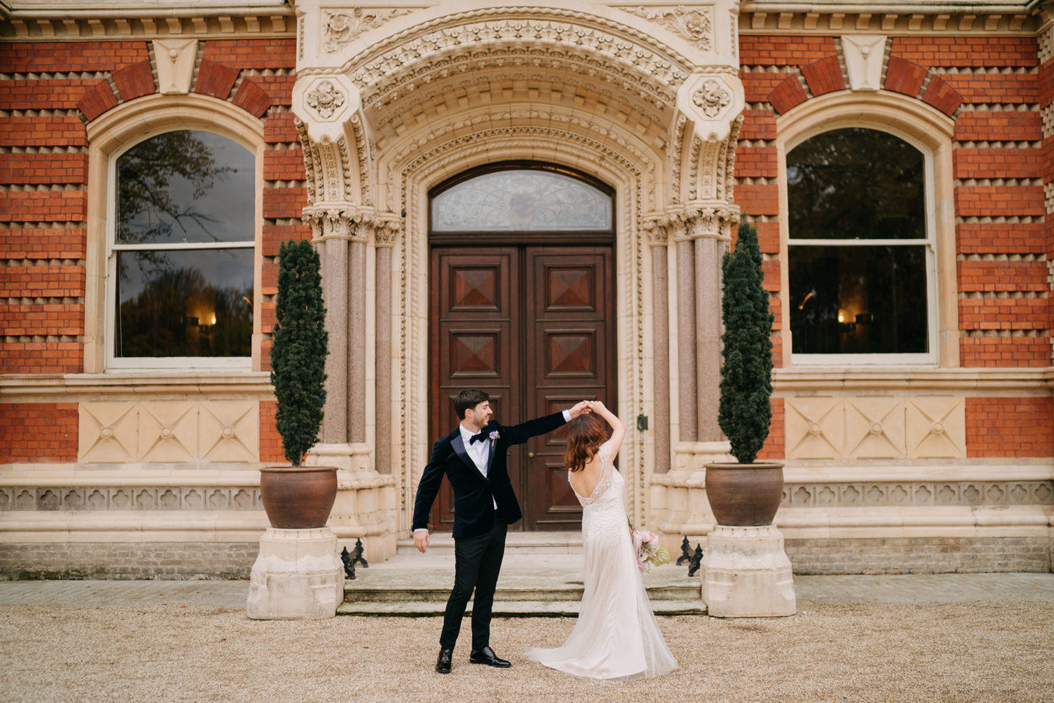 bride and groom dancing in front of dulwich college