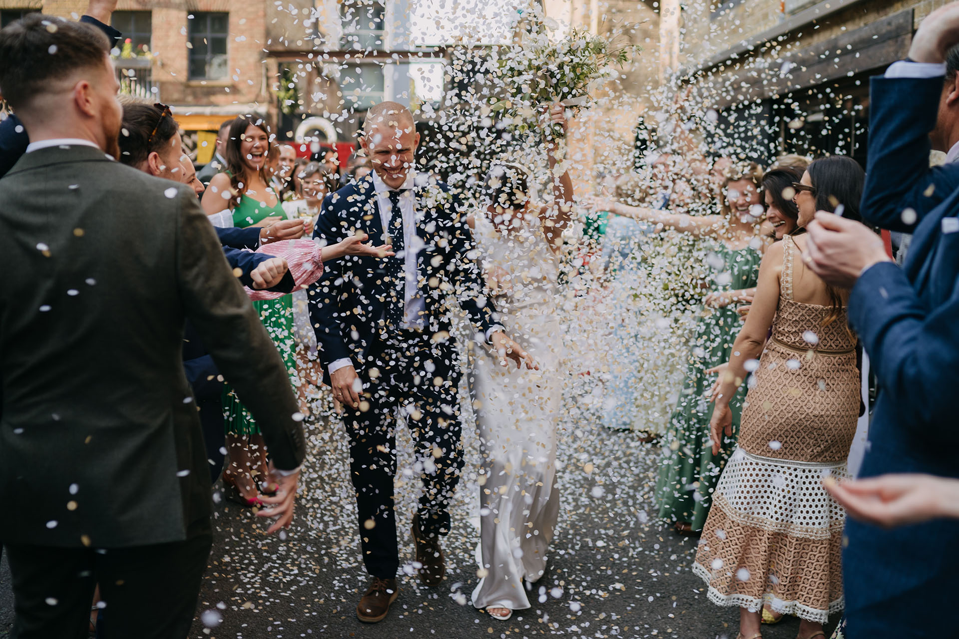 bride and groom showered in confetti at Shoreditch Studios wedding