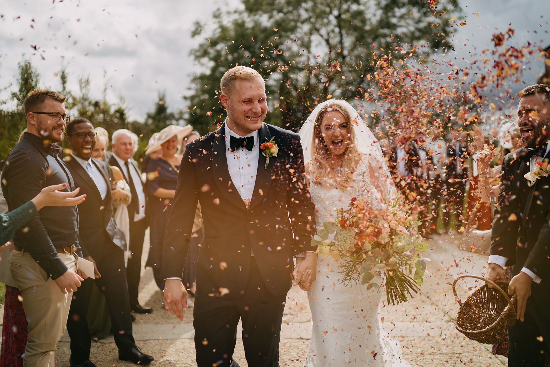 botley hill barn wedding confetti exit with lots of petals