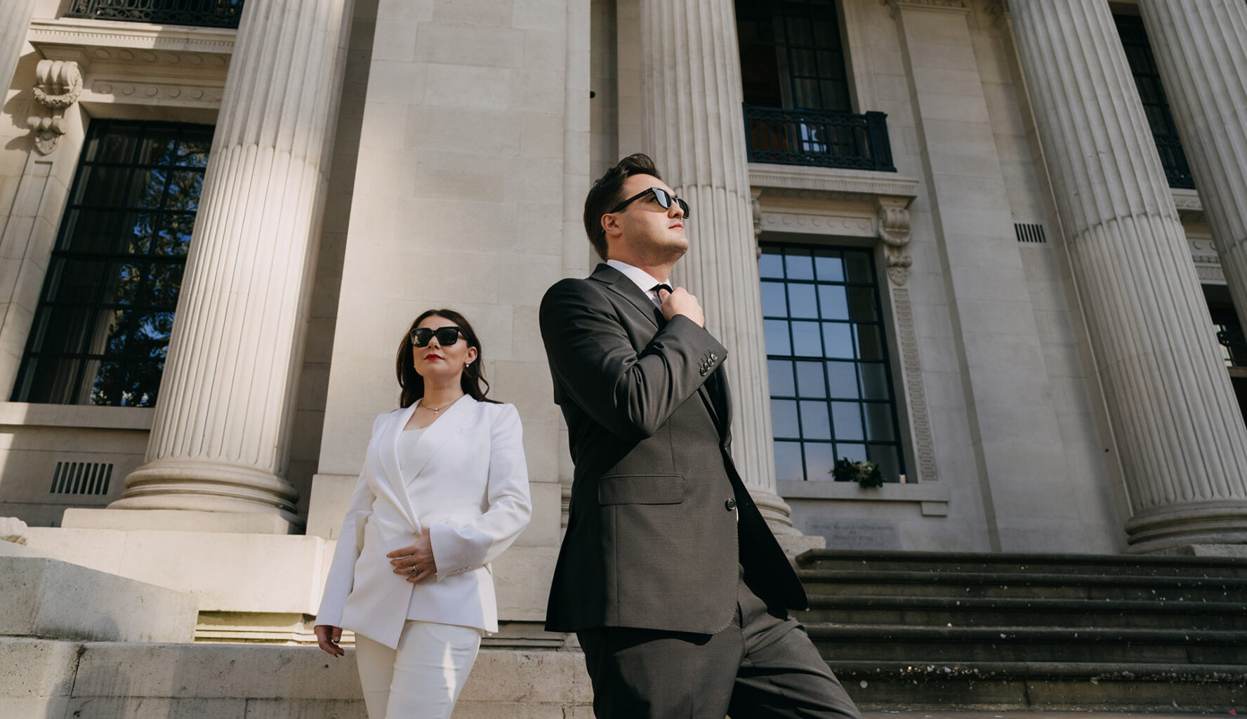 bride and groom posing like movie stars outside the old marylebone town hall
