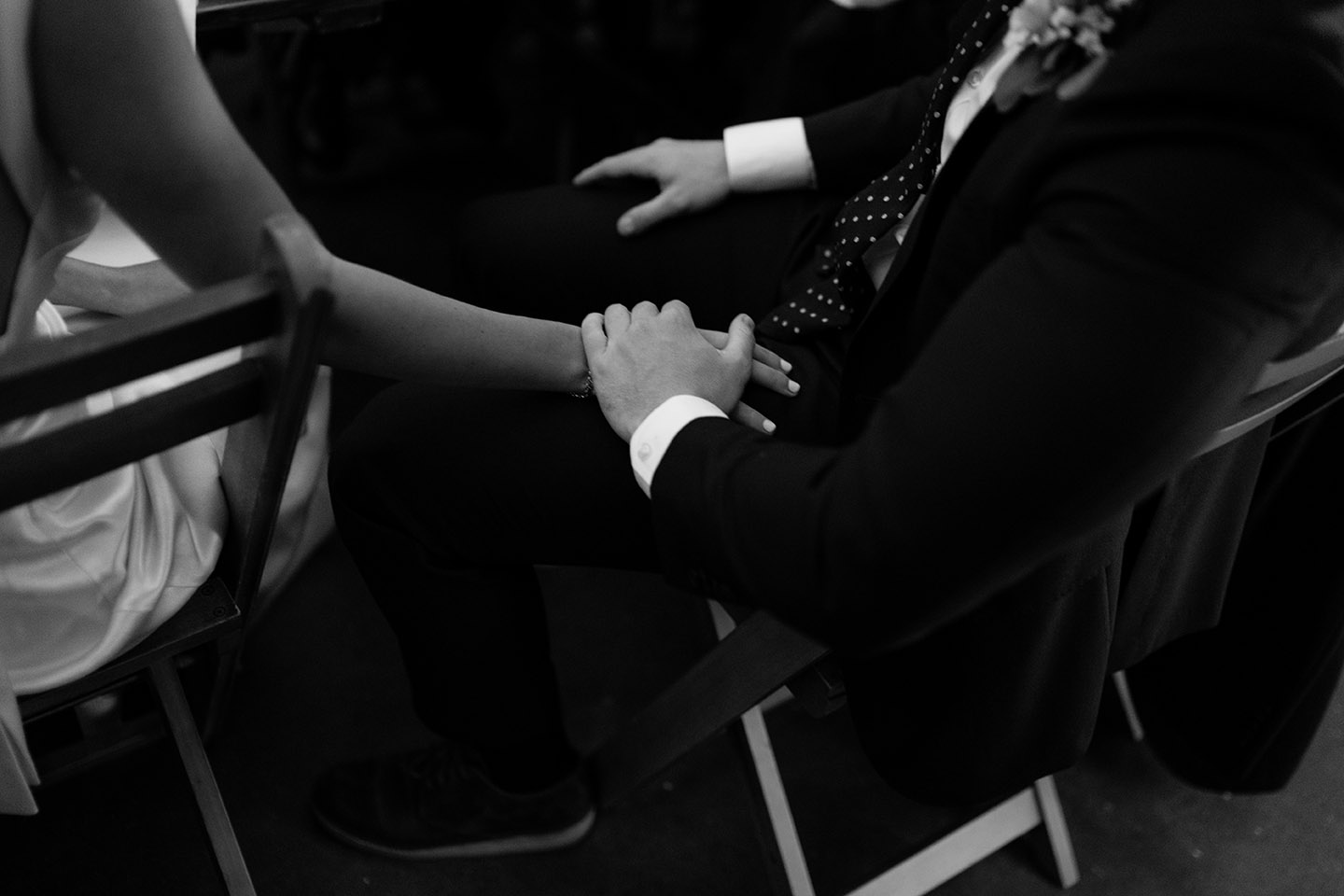 groom holding bride hand - cinematic wedding photography at shoreditch studios