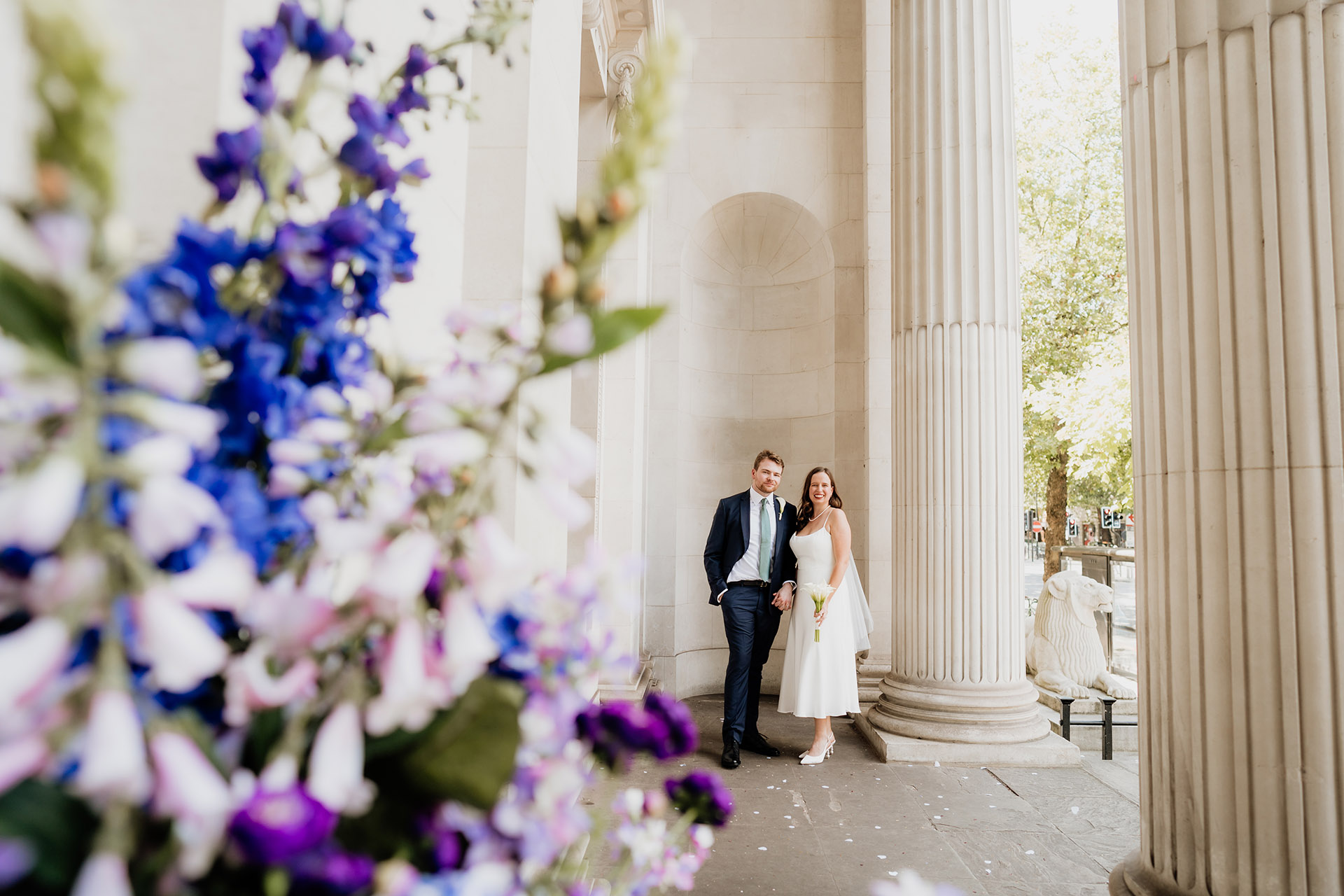 bride and groom posing at the old marylebone town hall wedding photography