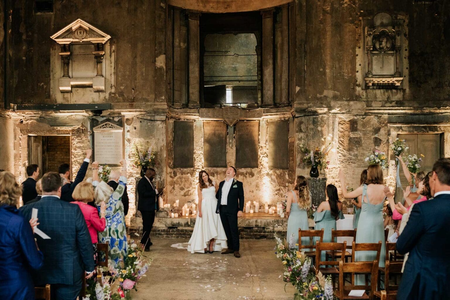bride and groom laughing happy at their wedding ceremony at the asylum chapel