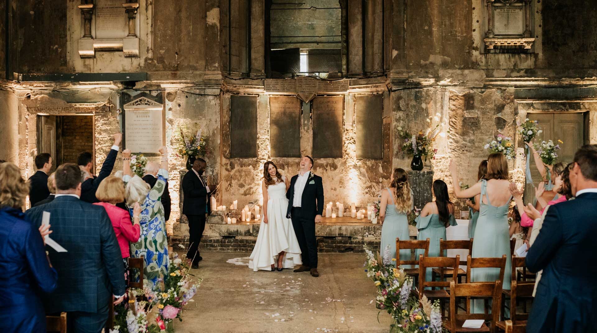 bride and groom laughing at asylum chapel wedding ceremony