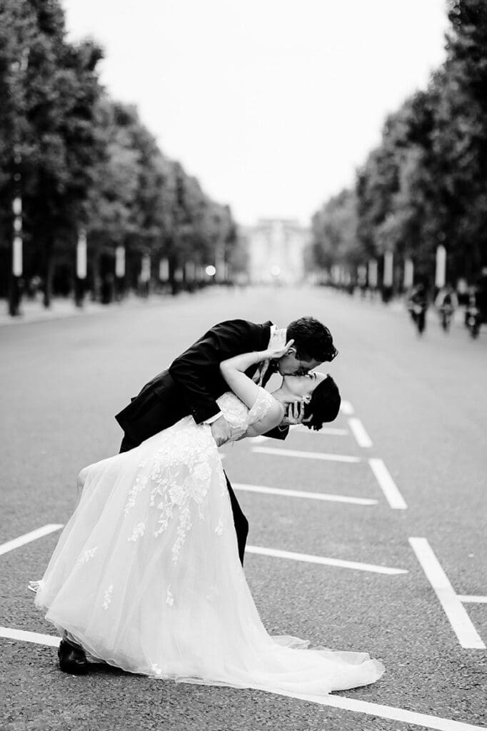 bride and groom kissing pose at the pall mall