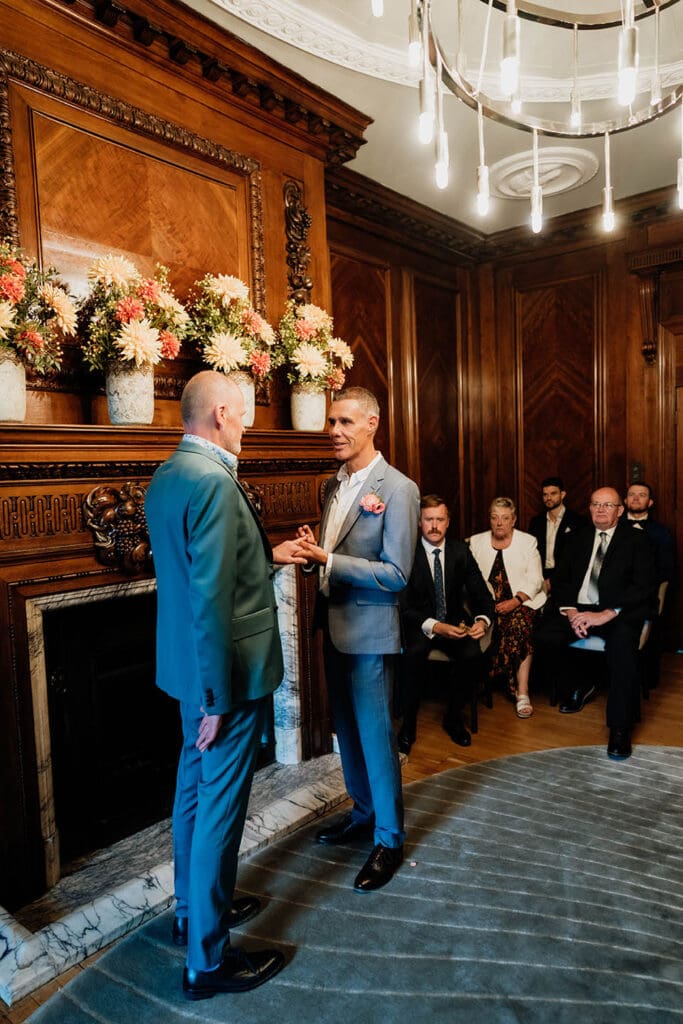 the marylebone room in the old marylebone town hall- micro wedding of two grooms, same sex marriage, ring exchange
