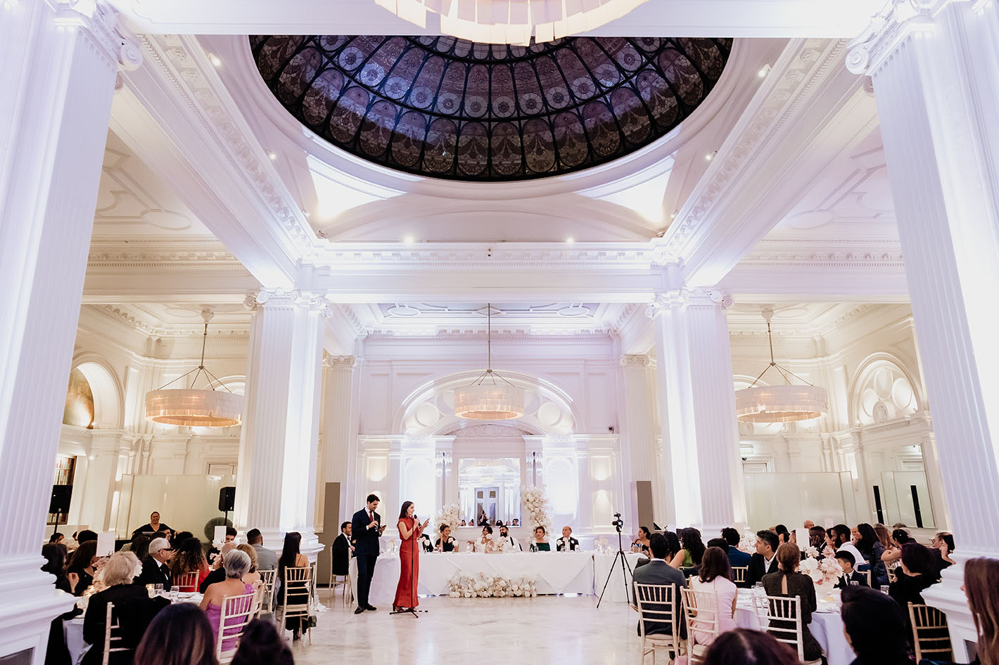 bridesmaid in a red dress and a best man making wedding speeches at andaz hotel ballroom 1901
