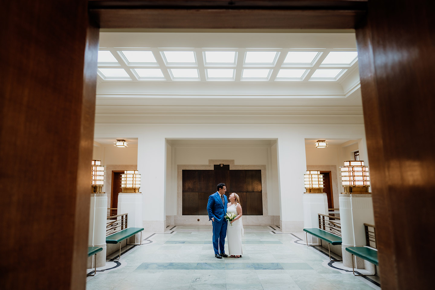 bride and groom in the art deco corridor or the hackney town hall