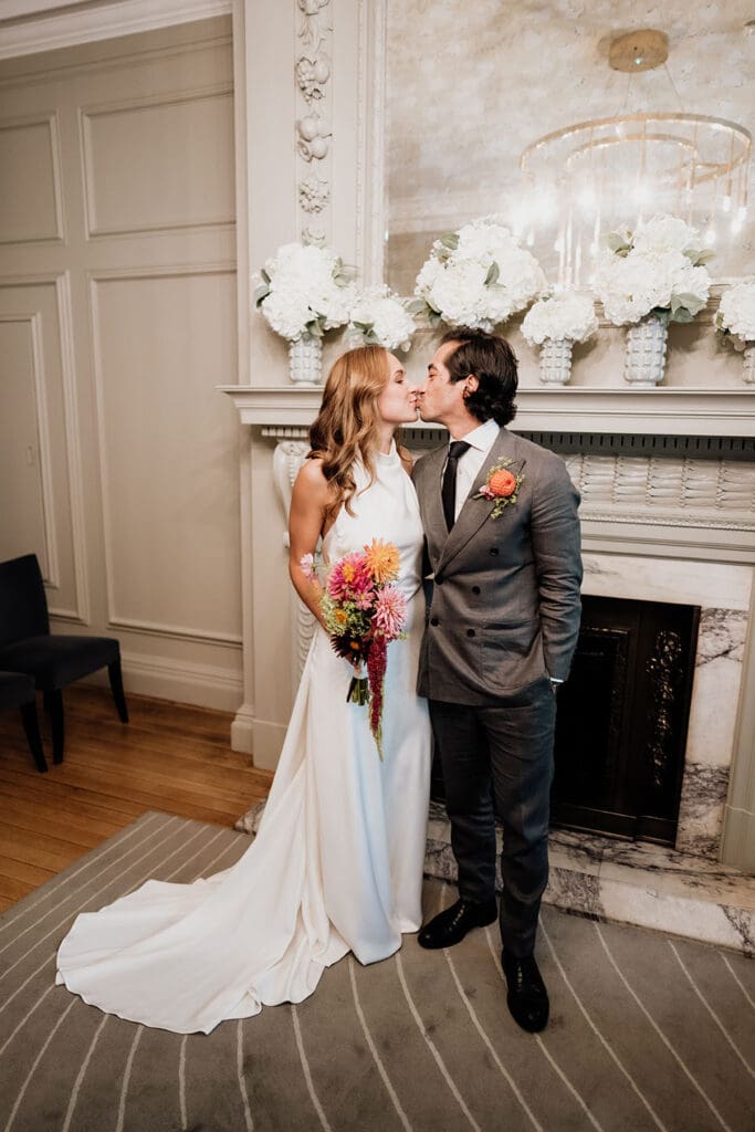 bride and groom kiss at the Soho Room in the Old Marylebone Town Hall wedding