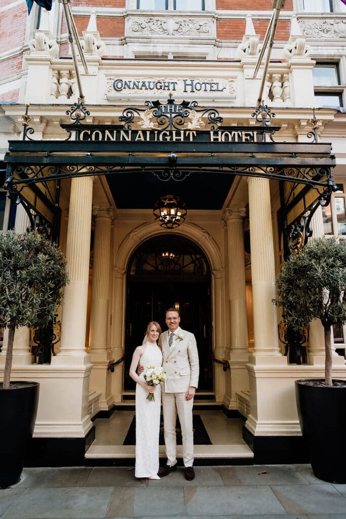 bride and groom outside the connaught hotel