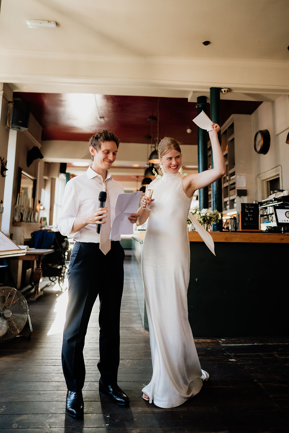 Bride and groom making a wedding speech together