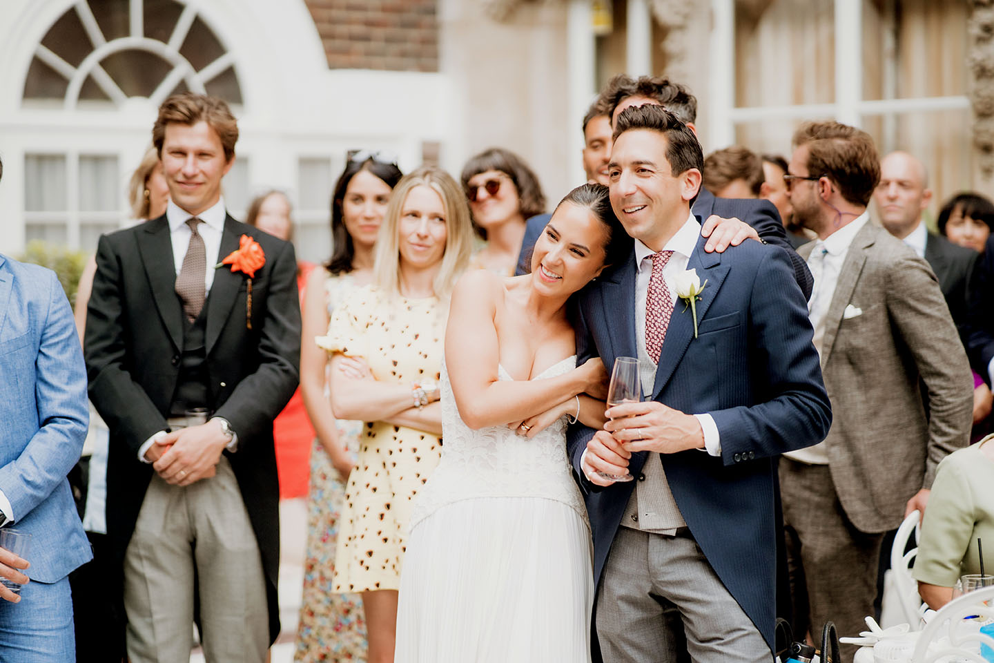 bride and groom embracing and smiling at standing wedding speeches at dartmouth house