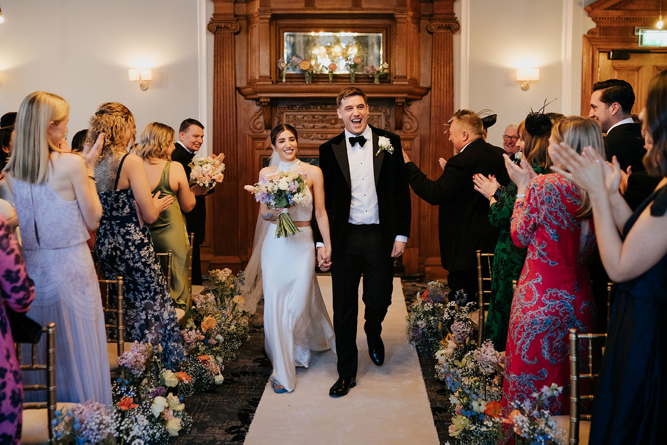 Happy couple ceremony exit at Bishopdgste at Andaz Hotel in London