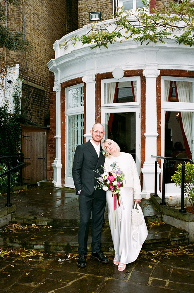 bride leaning on groom analogue nostalgic wedding photo