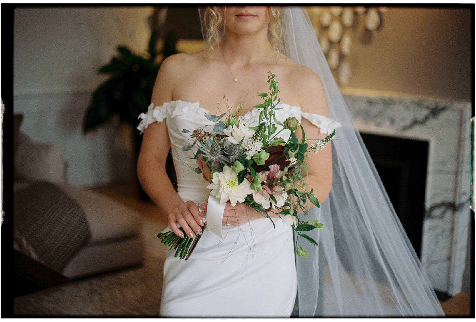 analogue wedding photo of bride and flowers without face