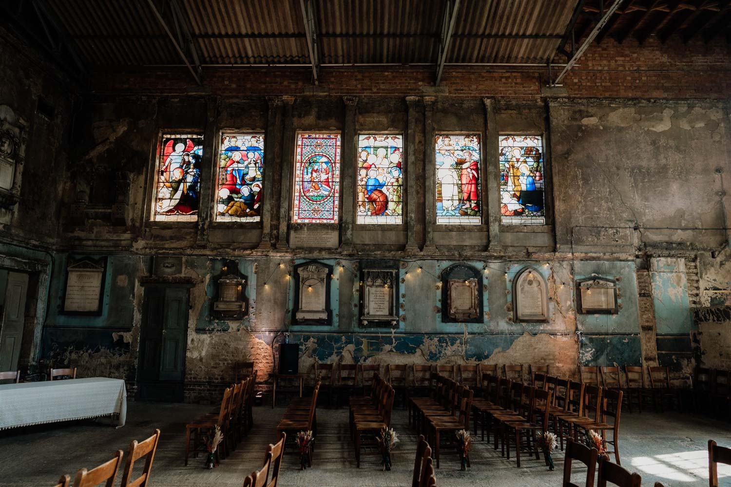 dramatic and moody light in empty asylum chapel ceremony room
