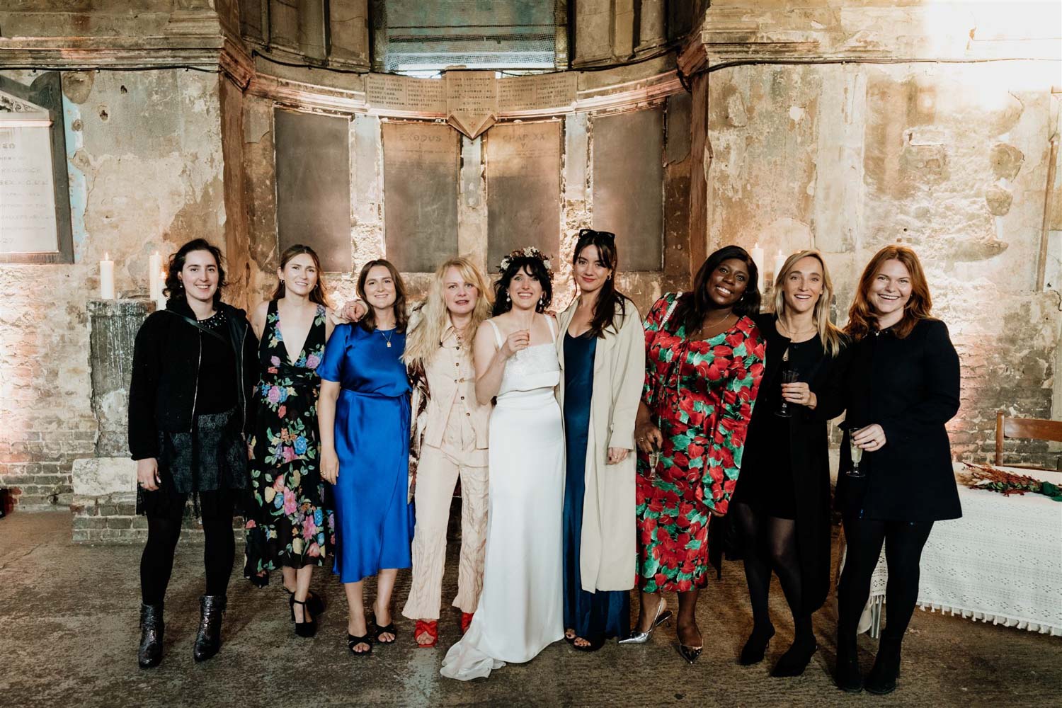 natural group shot of bride and friend inside asylum chapel in london