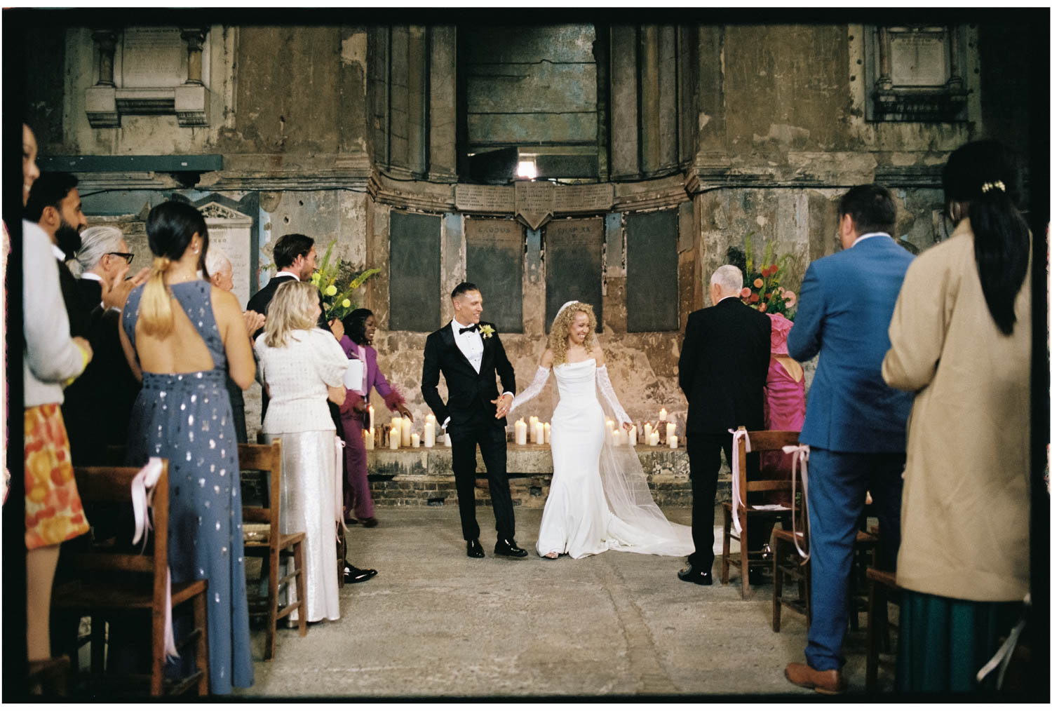 Bride and groom standing at the altar inside Asylum Chapel Peckham during their London wedding ceremony